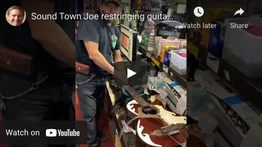 Sound Town Joe restringing guitar. At you service!